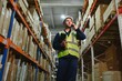 © Serhii - Portrait of warehouseman with clipboard checking delivery, stock in warehouse