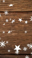 Poster - Animation of christmas stars falling over wooden background