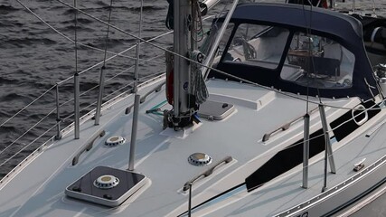 Aufkleber - A white sailboat gliding smoothly on the surface of the water, perfect for a relaxing day at sea
