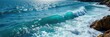© Uravan - Vast, deep blue ocean waves crashing against a rocky shore, creating a dramatic seascape Sunlight glints off the water's surface, highlighting the texture and power of the ocean , tranquility, spray