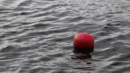 Poster - A single red buoy floats on the surface of calm water