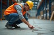 © Pete - Worker inspects crack concrete floor warehouse. Man wearing safety gear checks damage. Safety first in industry. Technician examines surface for construction, repair work. Worker, industry pro,