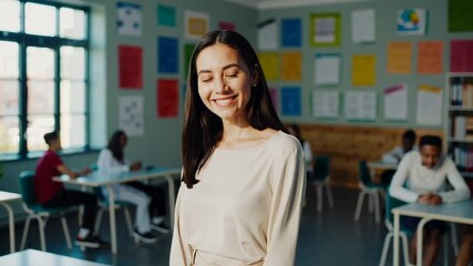 Poster - Female teacher standing by whiteboard, warmly interacting with students working at desks during collaborative educational moment
