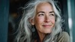© standret - Portrait of a joyful mature woman with grey hair and serene expression