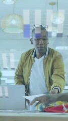 Poster - Diverse team discusses documents, animating statistical data in a business setting.