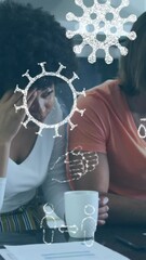 Aufkleber - Animation of pandemic icons over diverse couple using laptop