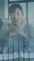 Poster - Asian businesswoman holds paper in a digital global video conference.