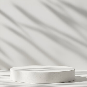 Empty white concrete podium with natural light shadows. Minimalist display platform for product presentation in a modern interior setting.