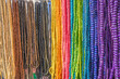 © Austockphoto - A close up of a rack of rainbow coloured beads