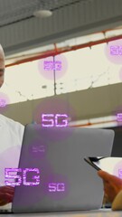 Poster - Animation of multiple 5g texts over diverse coworkers working on laptop and digital tablet