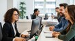 © MST - Diverse Professionals Collaborating and Smiling in Modern Office