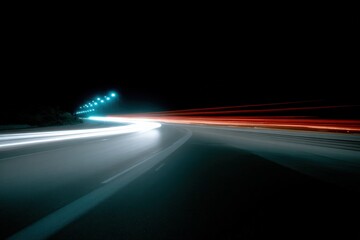Poster - Long exposure night highway with moving vehicle light trails illuminated by streetlights creating dynamic motion and vibrant colors on dark road surface
