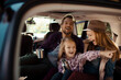 © Davor - Family road trip enjoying hot drinks in the back of SUV