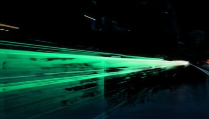 Poster - Abstract green light trails streak across a dark night cityscape at high speed