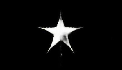 Poster - Dramatic white star shape on a black background creating a visual contrast effect.