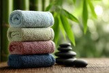 Dynamic pastel eco spa scene with towels stones rolled  
