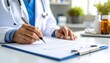 © 24DIY - Doctor's hands writing on a medical document with a pen pills and medicine bottles on the table in the background