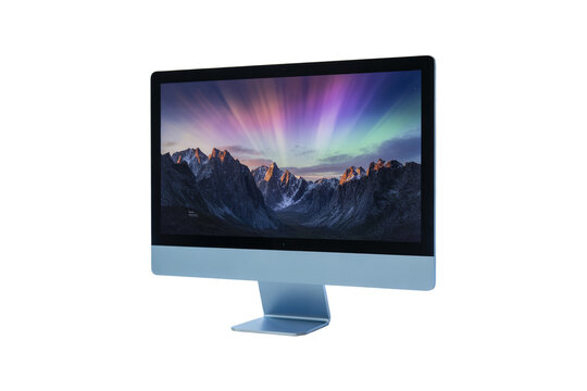 Modern computer monitor displaying a vibrant aurora borealis over snow capped mountains