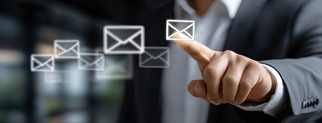 Poster - Close-up of a businessman pointing at bright email icons, showcasing digital marketing and communication in a professional environment
