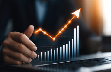 Poster - Businessman holding digital arrow pointing upward, symbolizing growth and success in finance, with graph showing upward trend on laptop screen