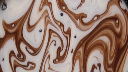 Poster - Chocolate and milk blending, creating hypnotic swirling patterns with smooth, mesmerizing movement of creamy liquid textures in dynamic visual fusion