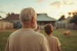 © Dennis - Grandparents enjoying watching grandchildren playing in the backyard