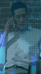 Poster - Animation of graph and map over asian man sitting with laptop and talking on smartphone