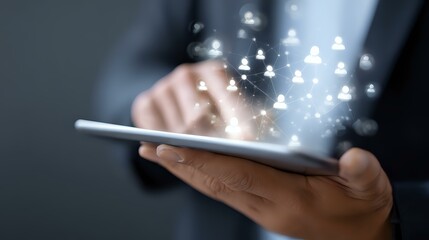 Poster - Glowing social network icons emerging from digital tablet screen held by business professional in dark setting, representing digital connectivity.