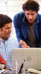 Poster - Animation of statistical data processing against diverse colleagues discussing over laptop at office