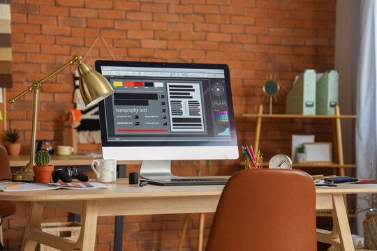 Interior designer's workplace with computer monitor in office
