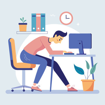 Young professional working at a desk with computer in a modern office environment