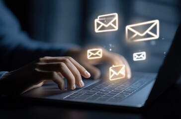 Poster - Modern digital communication concept with glowing email icons flying above a person's hands typing on a laptop keyboard in a dark environment