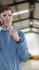 Poster - Animation of man talking on smartphone with stacks of boxes in warehouse