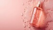 © Ubix - Skincare in pink dream : A close-up image of a bottle of liquid skincare essence, adorned with scattered drops of liquid on a soft pink backdrop, presenting a vision of delicate beauty and hydration