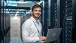 © StocksJust4You - A smiling IT engineer works confidently on a laptop inside a high-tech data center, surrounded by server racks—symbolizing technology, cybersecurity, and modern digital