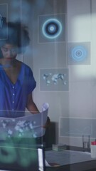 Poster - Animation of data processing and scopes over african american businesswoman in office