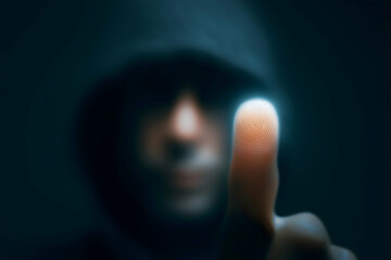 Aufkleber - A hooded figure presses a glowing finger with a visible fingerprint pattern towards a dark, digital interface.