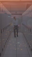 Poster - Composite video of caucasian male engineer walking in server room against night city traffic