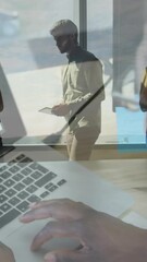 Poster - Animation of african american businessman using laptop over people at office