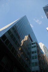 Poster - Low angle view of modern glass buildings against sky