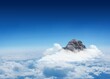 © vectorfusionart - Mountain peak through the clouds
