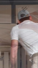 Leinwandbilder - Deliveryman tacking out packages from his van 4k