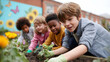 © SolaruS - Diverse children gardening together, planting seedlings in fertile soil. Concept teamwork, education, nature, sustainability. Ideal for school, environmental themes.
