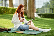 © Bliss - Relaxing in the park with a warm drink while enjoying a sunny afternoon outdoors