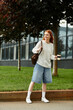 © Bliss - Joyful woman enjoying her spare time in a vibrant urban atmosphere on a sunny day