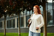 © Bliss - Young woman enjoys her spare time while walking in the park on a sunny afternoon