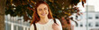 © Bliss - Joyful young woman enjoying her spare time under vibrant autumn leaves in the city
