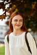 © Bliss - Young beautiful woman enjoying a sunny day outdoors with a smile and twinkling eyes