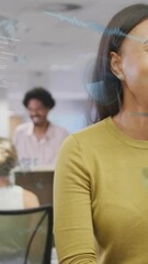 Poster - Animation of computer language over diverse female coworkers standing and discussing in office