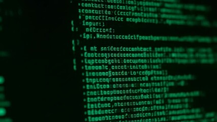 closeup of green computer code display with blurred background